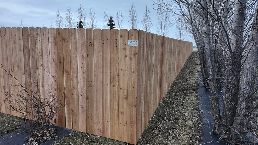 Wood fence installation project by professional contractors in Grand Forks ND